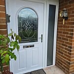 High-security composite door with multi-point locking system and reinforced frame for enhanced protection.
