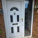 High-security composite door with multi-point locking system and reinforced frame for enhanced protection.